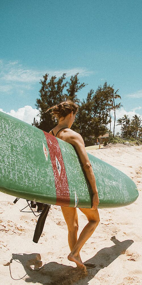 Lady with surfboard, Maui